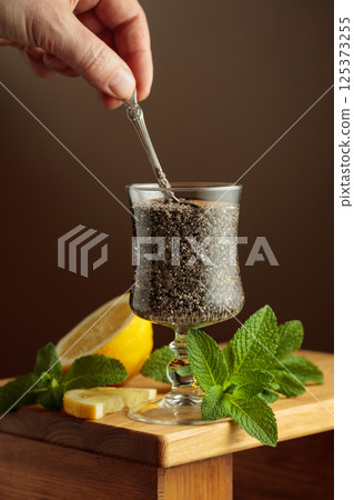 Diet and detox cocktail with chia seeds, lemon, and mint. 125373255