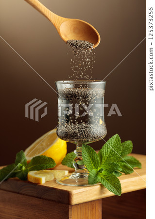 Diet and detox cocktail with chia seeds, lemon, and mint. 125373256