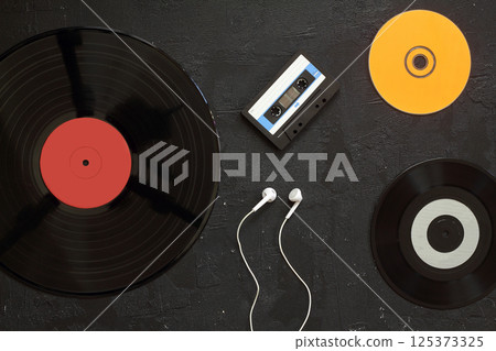 Vinyl record, cd, audio and video cassettes top view 125373325