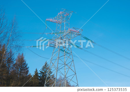 Electric power masts and cables, pylons. Electricity power station. 125373535