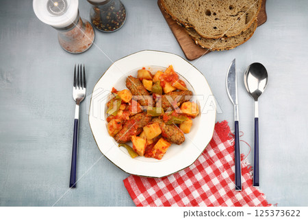 Traditional Homemade Turkish Food Kofte - Kofta with Tomato Sauce and Potatoes. (Turkish name; Izmir kofte) 125373622