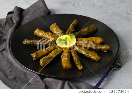 Stuffed collard greens with boiled leaves, traditonal turkish black sea region food, sarma, dolma 125373634