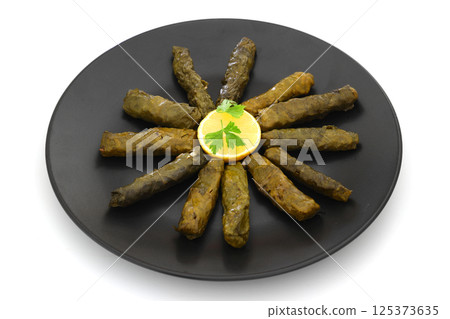 Stuffed collard greens with boiled leaves, traditonal turkish black sea region food, sarma, dolma Stuffed collard greens with boiled leaves, traditonal turkish black sea region food, sarma, dolma 125373635