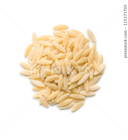 Orzo, kritharaki, risoni pasta. Uncooked dry pasta isolated on white background. Orzo, kritharaki, risoni pasta. Uncooked dry pasta isolated on white background. 125373705