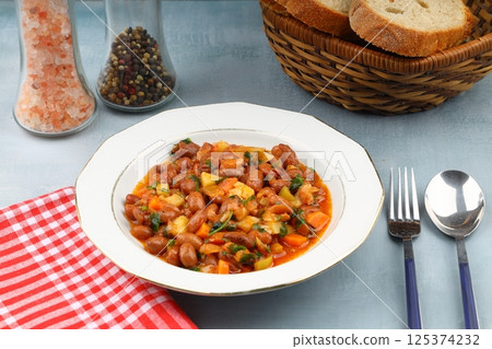 Traditional delicious Turkish food; Kidney beans with olive oil, Red kidney bean stew, Turkish name; Barbunya pilaki 125374232