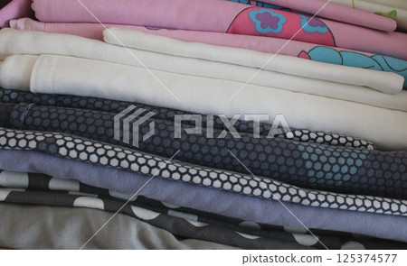 Folds Of Cozy Children Size And Colors Bedding In A Stack Closeup Stock Photo 125374577