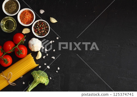 Italian Food background on black stone table. Top view. 125374741