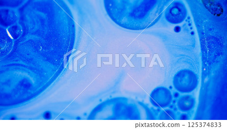 Glowing bubbles. Defocused wet drop. Blinking beautiful gleaming sparkling blue color paint liquid motion on abstract bokeh light background. Glowing bubbles. Defocused wet drop. Blinking beautiful gleaming sparkling blue color paint liquid motion on abstract bokeh light background. 125374833