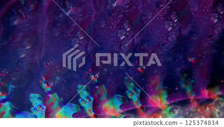 Liquid paint. Defocused fluid mix. Purple color beautiful sparkling soapy water floating bubbles going on blurred bokeh light abstract dark modern background. Liquid paint. Defocused fluid mix. Purple color beautiful sparkling soapy water floating bubbles going on blurred bokeh light abstract dark modern background. 125374834