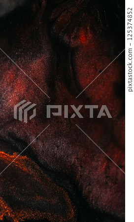 Paint background. Sparkling fluid. Defocused orange bronze color ink in water chemical drop floating on art dark black abstraction. Paint background. Sparkling fluid. Defocused orange bronze color ink in water chemical drop floating on art dark black abstraction. 125374852