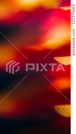 Optical leak. Blur dawn glow. Defocused purple pink yellow rainbow spectrum lens flare spreading on abstract light background. 125374863