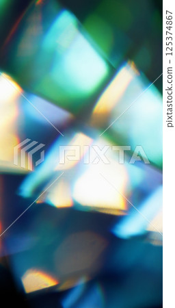 Bokeh energy. Blur ray abstract. Defocused green blue yellow multicolor flare light magic lens texture on dark black background. Bokeh energy. Blur ray abstract. Defocused green blue yellow multicolor flare light magic lens texture on dark black background. 125374867