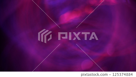 Twinkling glare. Defocused fluorescent circle. Attractive neon red blue purple color bright flow lens flare swirling on blurred bokeh light background. Twinkling glare. Defocused fluorescent circle. Attractive neon red blue purple color bright flow lens flare swirling on blurred bokeh light background. 125374884