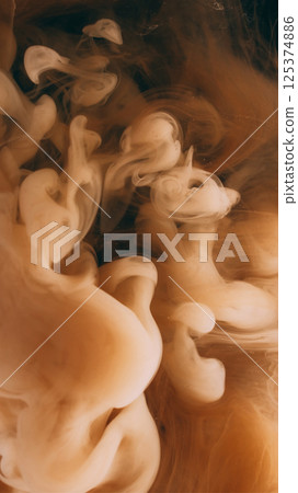 Smoke paint. Vapor cloud. Defocused yellow color splash ink in water explosion flow growing on abstract art dark black background. 125374886