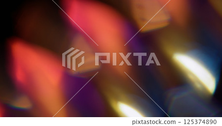 Light refraction. Blur glint gleam. Defocused pink purple yellow colorful sparkle kaleidoscope floating on abstract art background. 125374890