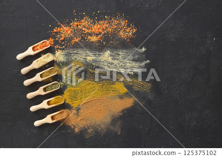 Big set of Indian spices on wooden table. Top view, Horizontal image. Big set of Indian spices on wooden table. Top view, Horizontal image. 125375102