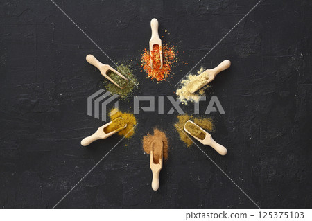 Big set of Indian spices on wooden table. Top view, Horizontal image. 125375103