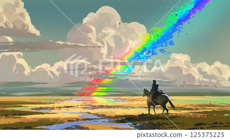 Rider Watches a Broken Rainbow in Vast Landscape 125375225