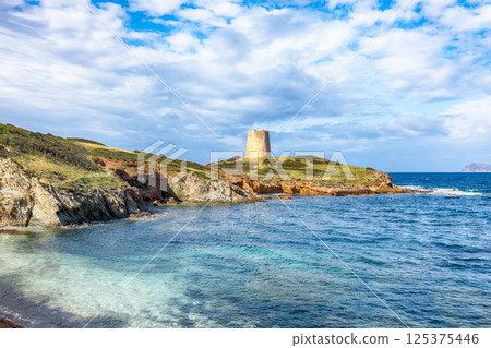 Attractive morning view  of Piscinni bay with turquoise sea and famous coastal tower of Piscinni. 125375446