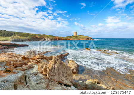 Amazing morning view of Piscinni bay with turquoise sea and famous coastal tower of Piscinni Amazing morning view of Piscinni bay with turquoise sea and famous coastal tower of Piscinni 125375447