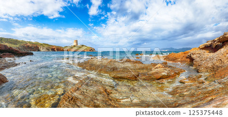 Amazing morning view  of Piscinni bay with turquoise sea and famous coastal tower of Piscinni 125375448