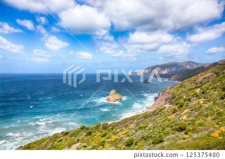 Attractive spring view of Nebida and Masua coast and Pan Di Zucchero on background. Attractive spring view of Nebida and Masua coast and Pan Di Zucchero on background. 125375480