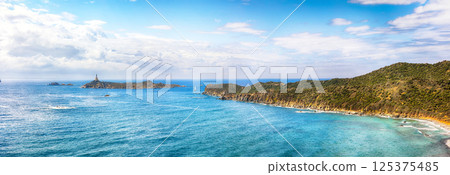 Marvelous view of Capo Carbonara lighthouse with turquoise water Marvelous view of Capo Carbonara lighthouse with turquoise water 125375485