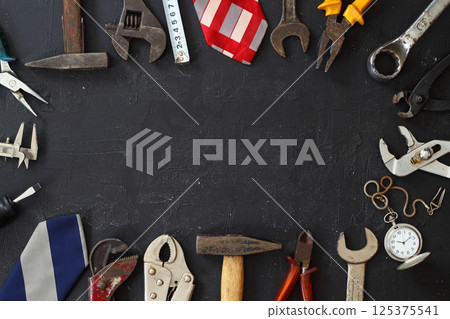 Top view design concept of Father 's day and labor day with working tools on black background 125375541