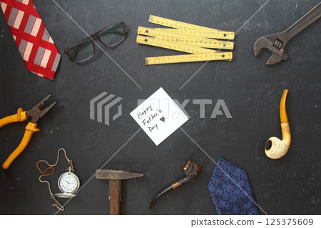 Top view design concept of Father\'s day and labor day with working tools on blue background. 125375609