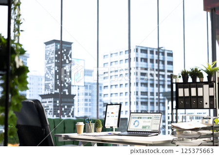 Empty modern corporate high end office space designed for a CEO or person with authority, running analytics and reports on screen. Urban global enterprise workspace, empowerment. Empty modern corporate high end office space designed for a CEO or person with authority, running analytics and reports on screen. Urban global enterprise workspace, empowerment. 125375663