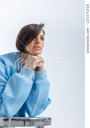 Portrait of young woman close-up on grey background. Studio photography. Vertical photo. High quality photo Portrait of young woman close-up on grey background. Studio photography. Vertical photo. High quality photo 125375810