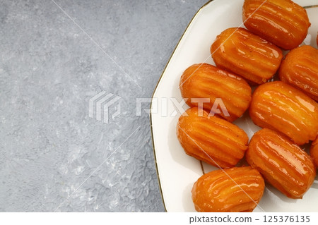 Tulumba dessert is a deep-fried dessert found in Ottoman cuisine and the regional cuisines of the former Ottoman Empire. Tulumba dessert is a deep-fried dessert found in Ottoman cuisine and the regional cuisines of the former Ottoman Empire. 125376135