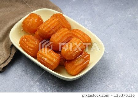 Tulumba dessert is a deep-fried dessert found in Ottoman cuisine and the regional cuisines of the former Ottoman Empire. Tulumba dessert is a deep-fried dessert found in Ottoman cuisine and the regional cuisines of the former Ottoman Empire. 125376136