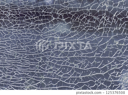 Detail of broken tempered glass pane too many small irregular shape pieces holding together. Detail of broken tempered glass pane too many small irregular shape pieces holding together. 125376508