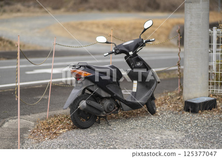Abandoned bike on a street corner Abandoned bike on a street corner 125377047