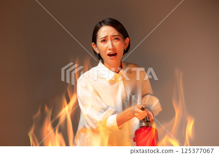 Woman Fire Extinguisher 125377067