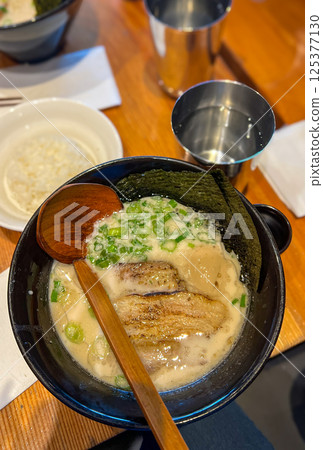 Japanese food, miso soup with fish in a bowl on the table Japanese food, miso soup with fish in a bowl on the table 125377130