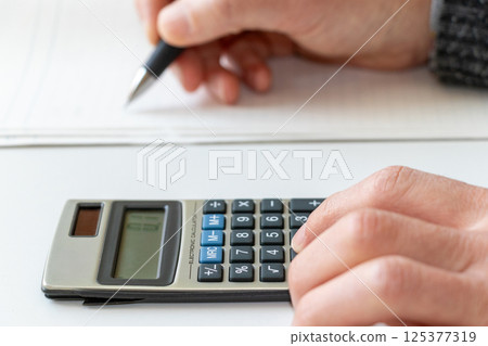 Doing calculations on a calculator 125377319