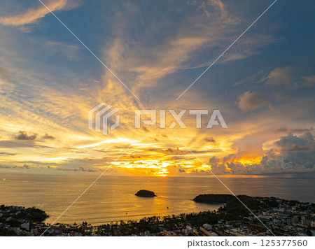 Aerial view of Colorful cloud in dramatic sky of sunset over the ocean Aerial view of Colorful cloud in dramatic sky of sunset over the ocean 125377560
