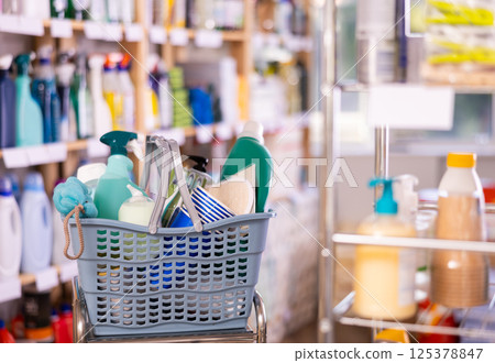 Shopping basket filled with cleaning supplies and personal care products 125378847