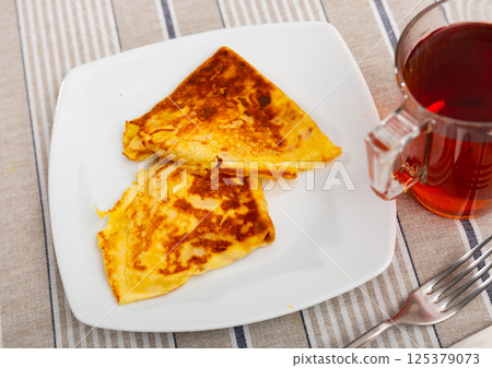 Pancakes stuffed with liver and egg Pancakes stuffed with liver and egg 125379073
