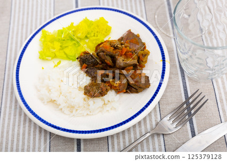 Chicken heart served with lettuce and rice Chicken heart served with lettuce and rice 125379128
