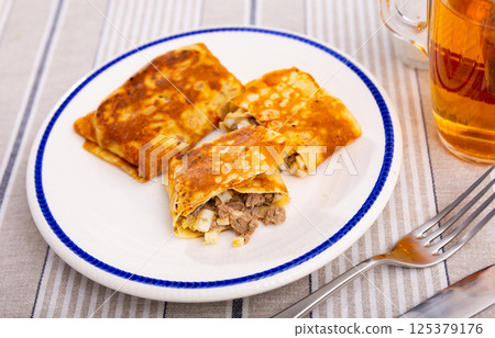 Delectable pancakes, featuring filling of minced liver and eggs, perfect for next breakfast Delectable pancakes, featuring filling of minced liver and eggs, perfect for next breakfast 125379176