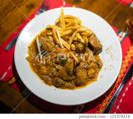 Pork with mushrooms and potatoes top view Pork with mushrooms and potatoes top view 125379218