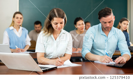 Portrait of attentive students on training session in auditorium 125379410
