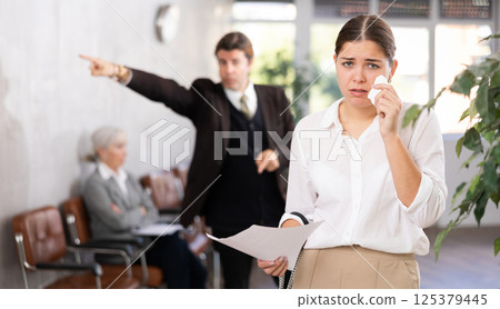 Female inexperienced new employee is upset because of boss s scolding 125379445