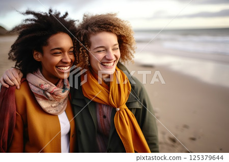 Oceanic Bonds Joyful Embrace of Two Women on a Breezy Beach, Laughter Echoing Waves, Windswept Hair, and Warm Scarves Unveiling Deep Connections. created with Generative AI 125379644