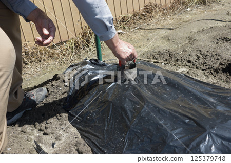 Black multi-hole drilling 125379748