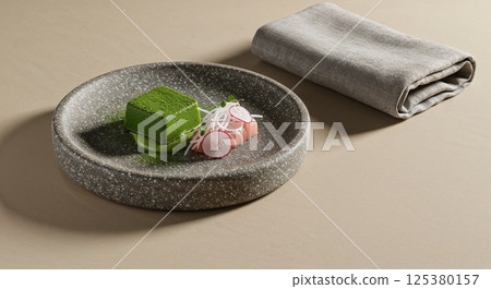 Elegant green dessert with radishes on stone plate 125380157