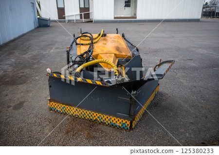 street sweeper brush and plow attachments with hydraulic hoses, concept of urban maintenance tools street sweeper brush and plow attachments with hydraulic hoses, concept of urban maintenance tools 125380233